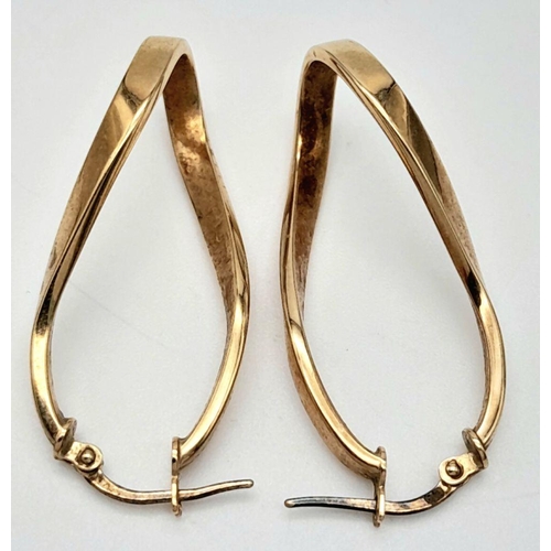 274 - A PAIR OF 9K GOLD CELTIC HOOP EARRINGS .  2.0gms