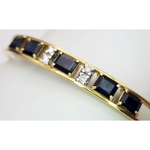 54 - A 14K (TESTED AS) YELLOW GOLD BANGLE SET WITH FIVE SAPPHIRES AND FOUR DIAMONDS, 6CM DIAMETER, 15.9G ... 