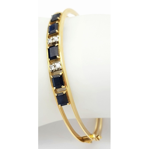 54 - A 14K (TESTED AS) YELLOW GOLD BANGLE SET WITH FIVE SAPPHIRES AND FOUR DIAMONDS, 6CM DIAMETER, 15.9G ... 