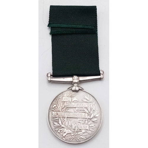 85 - A Volunteer Force Long Service Medal (India), GVR issue. Named in attractive flowing engraved script... 