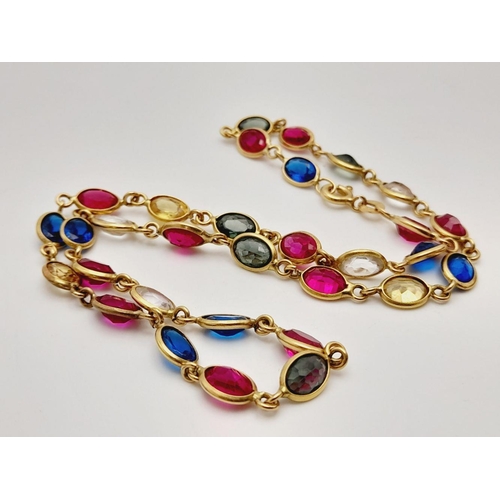 226 - An Italian 18K Yellow Gold Multi Gemstone Necklace. Sapphires, Rubies, White Topaz and Emeralds. 38c... 