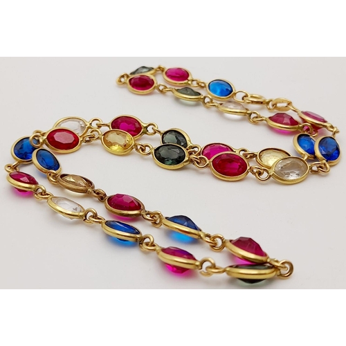 226 - An Italian 18K Yellow Gold Multi Gemstone Necklace. Sapphires, Rubies, White Topaz and Emeralds. 38c... 