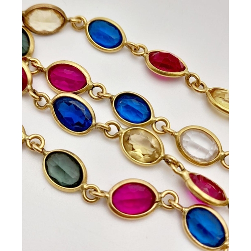 226 - An Italian 18K Yellow Gold Multi Gemstone Necklace. Sapphires, Rubies, White Topaz and Emeralds. 38c... 