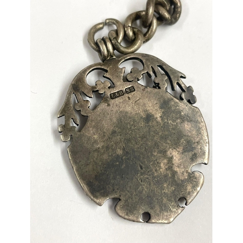 169 - A Pocket watch chain with silver fob ( Bombay ).