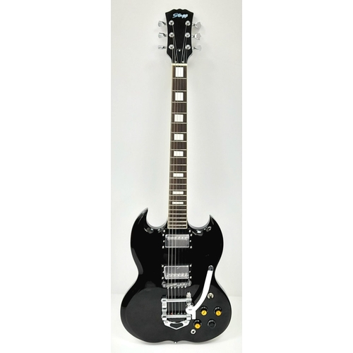 156 - A Good Condition Stagg Electric Guitar. Black lacquer exterior with multiple knobs and tremolo bar. ... 