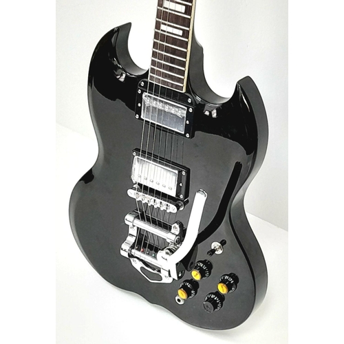 156 - A Good Condition Stagg Electric Guitar. Black lacquer exterior with multiple knobs and tremolo bar. ... 