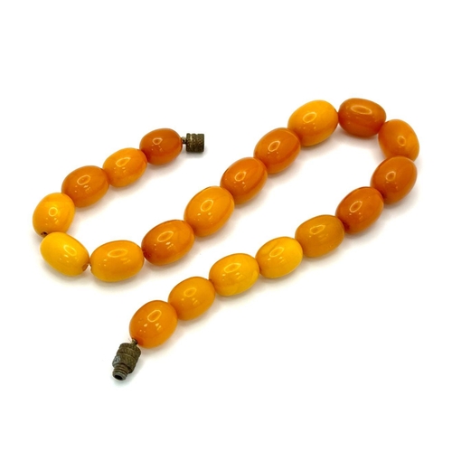 198 - A Vintage Honey Amber Barrel Beaded Child's Necklace. Please see UV light pictures to aid in authent... 