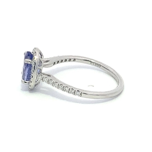 172 - A Platinum TANZANITE and DIAMOND halo ring. 1.41ct claw set oval shape Tanzanite centre, decorated w... 