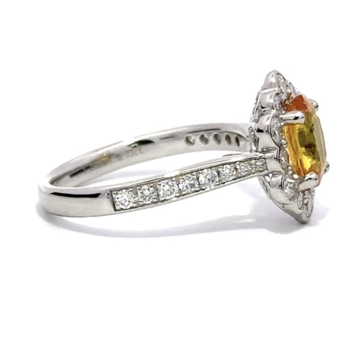 33 - A Platinum YELLOW SAPPHIRE and DIAMOND Cluster Ring. 1.50ct claw set oval shape Yellow Sapphire cent... 