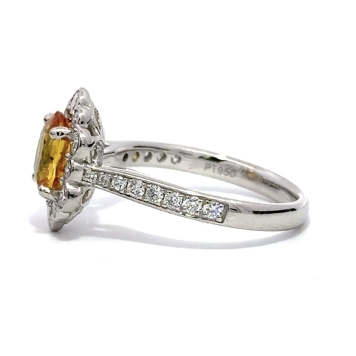 33 - A Platinum YELLOW SAPPHIRE and DIAMOND Cluster Ring. 1.50ct claw set oval shape Yellow Sapphire cent... 