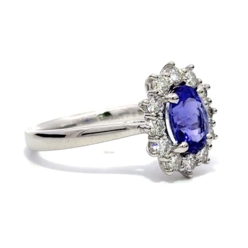 47 - A Platinum TANZANITE and DIAMOND Cluster Ring. 1.33ct claw set oval shape Tanzanite centre, decorate... 