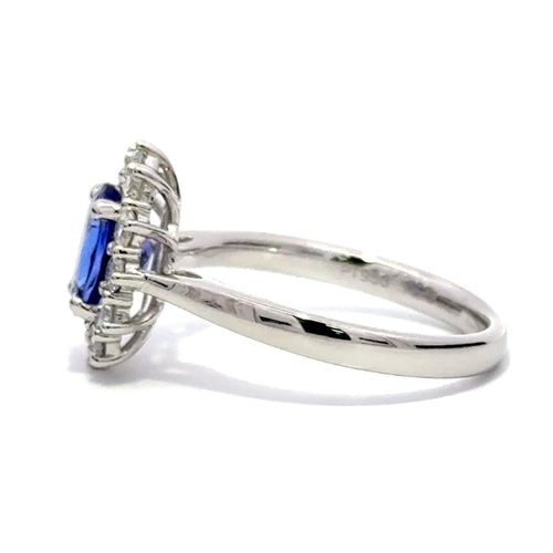 47 - A Platinum TANZANITE and DIAMOND Cluster Ring. 1.33ct claw set oval shape Tanzanite centre, decorate... 