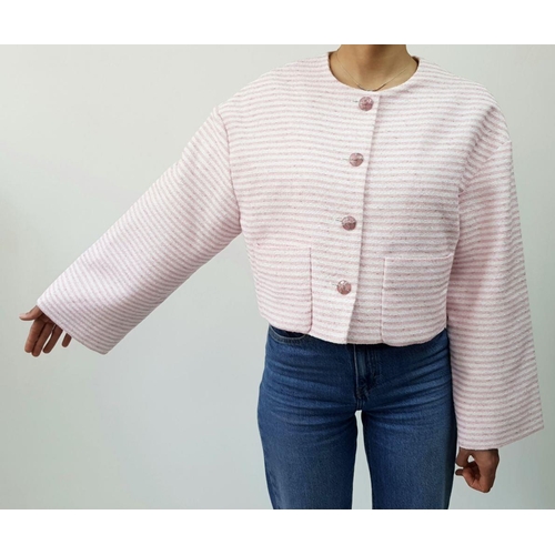 10 - A Chanel Pink and White Striped Cropped Jacket. Cotton, polyamide, and wool blend exterior with silv... 