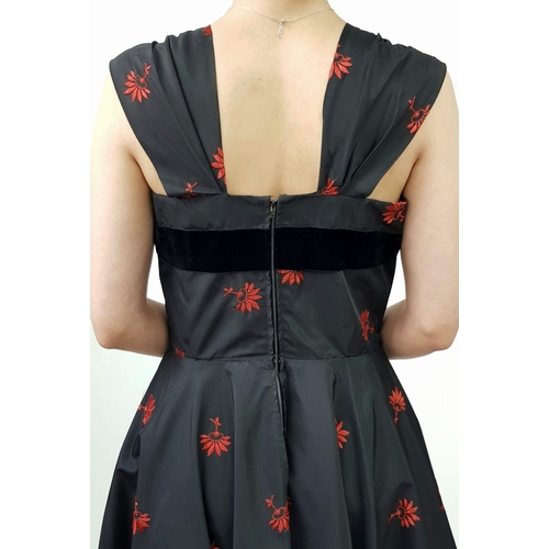 134 - A stunning 1950's style rockabilly dress by Robert Dorland, styled for Bourne and Hollingsworth. Two... 