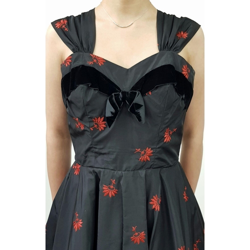 134 - A stunning 1950's style rockabilly dress by Robert Dorland, styled for Bourne and Hollingsworth. Two... 