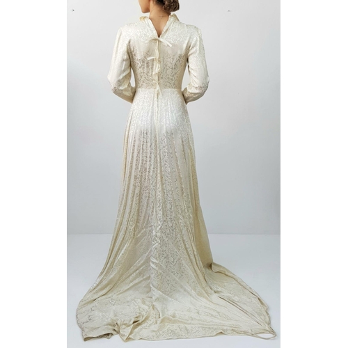 142 - A beautiful vintage occasion dress with full train, wired collar, full zip, does need some restorati... 