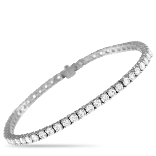 113 - A 18K White Gold 6.07ct Diamond Tennis Bracelet. A classic and chic wrist adornment shining bright w... 