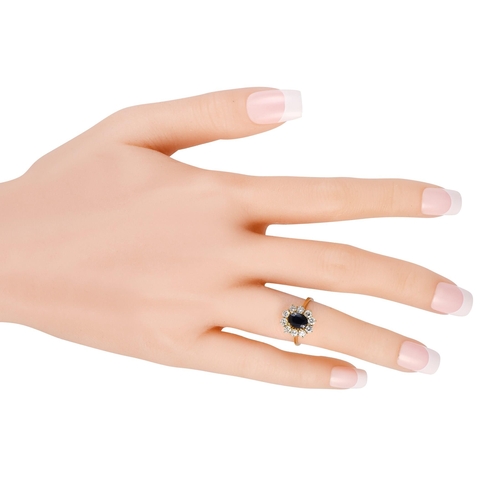 253 - A 18K Yellow Gold 0.55ct Diamond and Sapphire Ring , a 1.0 carat oval-cut sapphire makes a statement... 