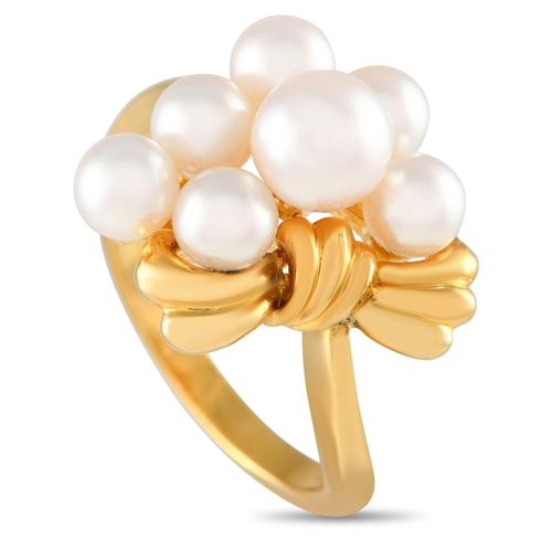 260 - A Mikimoto 18K Yellow Gold Pearl Ring. This yellow gold ring features a slim and slightly curved ban... 
