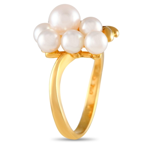 260 - A Mikimoto 18K Yellow Gold Pearl Ring. This yellow gold ring features a slim and slightly curved ban... 