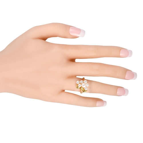 260 - A Mikimoto 18K Yellow Gold Pearl Ring. This yellow gold ring features a slim and slightly curved ban... 