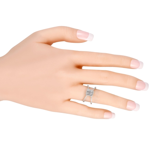 281 - A 14K White Gold 0.50ct Diamond Split Shank Ring. This piece in 14K white gold features two narrow s... 