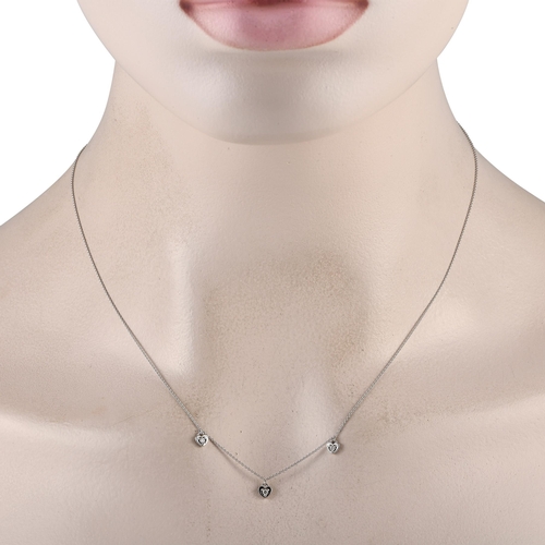 513 - A 14K White Gold 0.10ct Diamond Heart Station Necklace. Simple, elegant, and perfectly understated, ... 