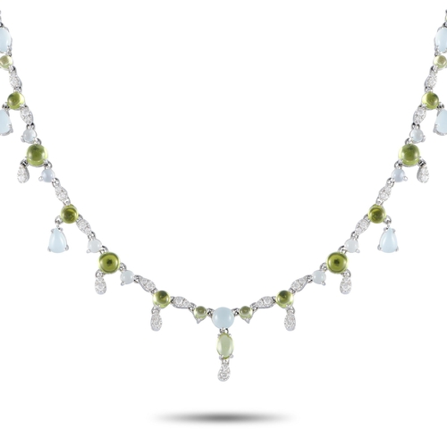 86 - A Bucherer 18K White Gold 0.55ct Diamond, Aquamarine and Peridot Necklace. The necklace is crafted i... 