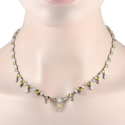 86 - A Bucherer 18K White Gold 0.55ct Diamond, Aquamarine and Peridot Necklace. The necklace is crafted i... 