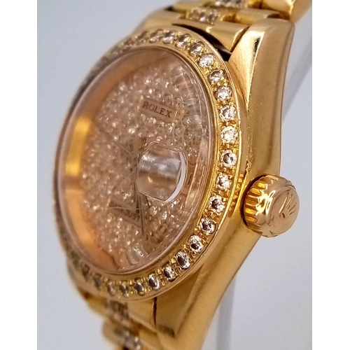 118 - A stunning 18 K yellow gold, ladies ROLEX watch with pave diamonds on bezel, dial and bracelet, case... 