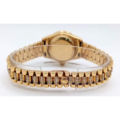 118 - A stunning 18 K yellow gold, ladies ROLEX watch with pave diamonds on bezel, dial and bracelet, case... 