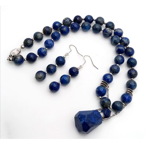 146 - A fabulous lapis lazuli necklace with a rare perfume bottle pendant and assorted earrings in a prese... 