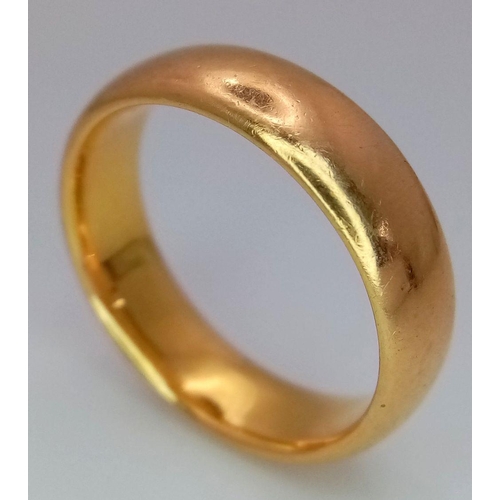 16 - A Classic 22K Yellow Gold Band Ring. 5mm width. Size P. 9.3g total weight. Full UK hallmarks.