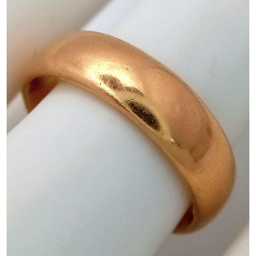 16 - A Classic 22K Yellow Gold Band Ring. 5mm width. Size P. 9.3g total weight. Full UK hallmarks.