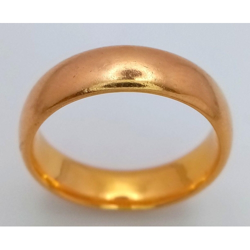 16 - A Classic 22K Yellow Gold Band Ring. 5mm width. Size P. 9.3g total weight. Full UK hallmarks.