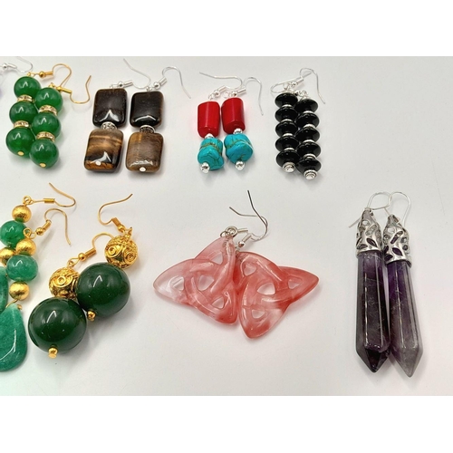160 - An eclectic collection of twelve pairs of earrings all with stones. Examples include jade, carnelian... 