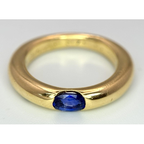 19 - An 18K Yellow Gold Cartier Ellipse Sapphire Band Ring. Size N. 9.2g total weight. Comes with origina... 