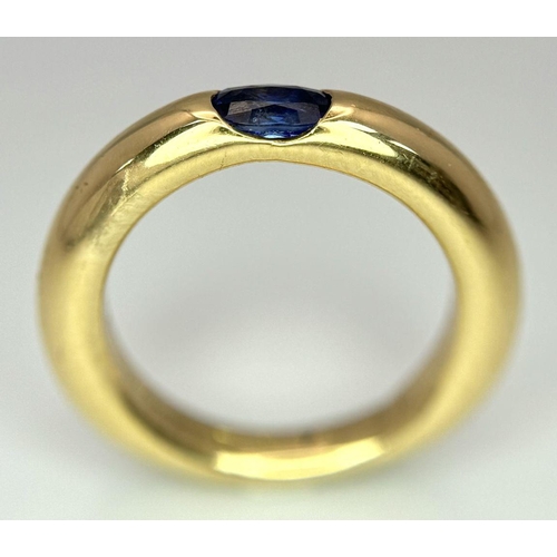 19 - An 18K Yellow Gold Cartier Ellipse Sapphire Band Ring. Size N. 9.2g total weight. Comes with origina... 