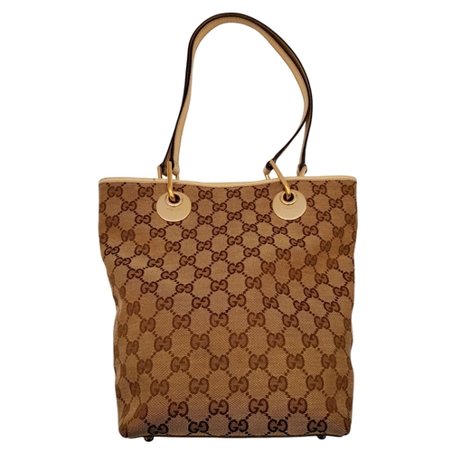 250 - A Gucci Brown/Beige Eclipse Tote Bag. Textile exterior with leather trim, gold-toned hardware, four ... 
