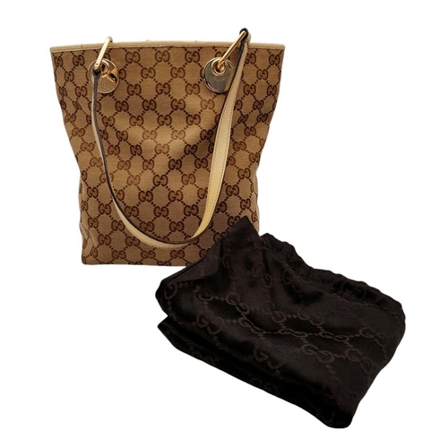 250 - A Gucci Brown/Beige Eclipse Tote Bag. Textile exterior with leather trim, gold-toned hardware, four ... 