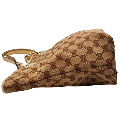 250 - A Gucci Brown/Beige Eclipse Tote Bag. Textile exterior with leather trim, gold-toned hardware, four ... 