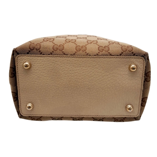 250 - A Gucci Brown/Beige Eclipse Tote Bag. Textile exterior with leather trim, gold-toned hardware, four ... 