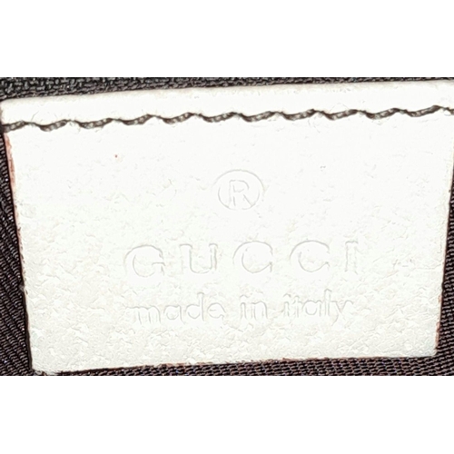 250 - A Gucci Brown/Beige Eclipse Tote Bag. Textile exterior with leather trim, gold-toned hardware, four ... 