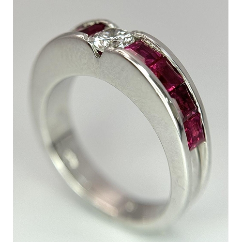 282 - An 18K White Gold Ruby and Diamond Ring. A central 0.25ct brilliant round cut diamond with four squa... 