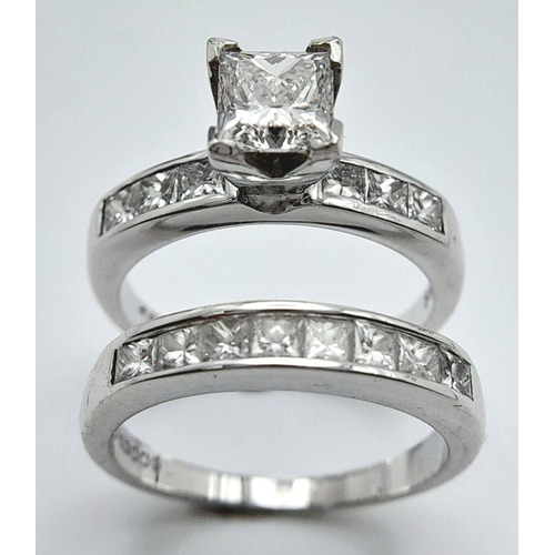 33 - An 18K White Gold and Diamond Bridal Ring Set. A Princess cut 0.55ct, near white (centre stone) diam... 