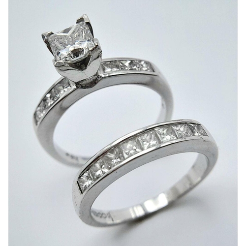 33 - An 18K White Gold and Diamond Bridal Ring Set. A Princess cut 0.55ct, near white (centre stone) diam... 