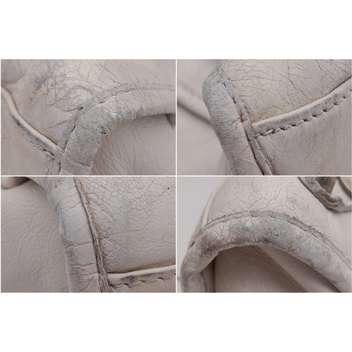 158 - A Balenciaga cream city leather handbag, silver tone hardware, black cloth interior with zip pocket,... 