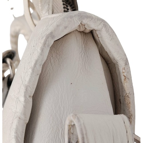 158 - A Balenciaga cream city leather handbag, silver tone hardware, black cloth interior with zip pocket,... 