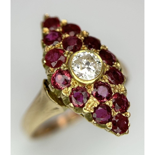 512 - A 14K Yellow Gold Ruby and Diamond Ring. Central diamond surrounded by 15 rubies in a marquise shape... 