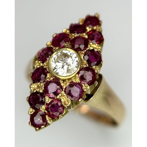 512 - A 14K Yellow Gold Ruby and Diamond Ring. Central diamond surrounded by 15 rubies in a marquise shape... 